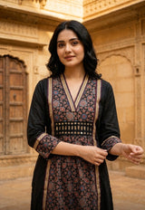 Woman wearing Black Ajrakh print Dress with mirror work | Kunvarani