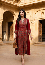 Woman wearing Red Ajrakh print dress with mirror work | Kunvarani