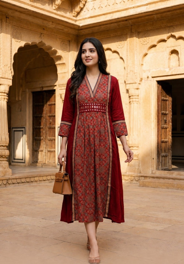 Woman wearing Red Ajrakh print dress with mirror work | Kunvarani