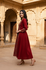 Woman wearing Red Ajrakh print dress with mirror work | Kunvarani