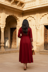 Woman wearing Red Ajrakh print dress with mirror work | Kunvarani