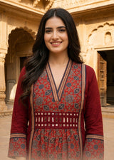 Woman wearing Red Ajrakh print dress with mirror work | Kunvarani