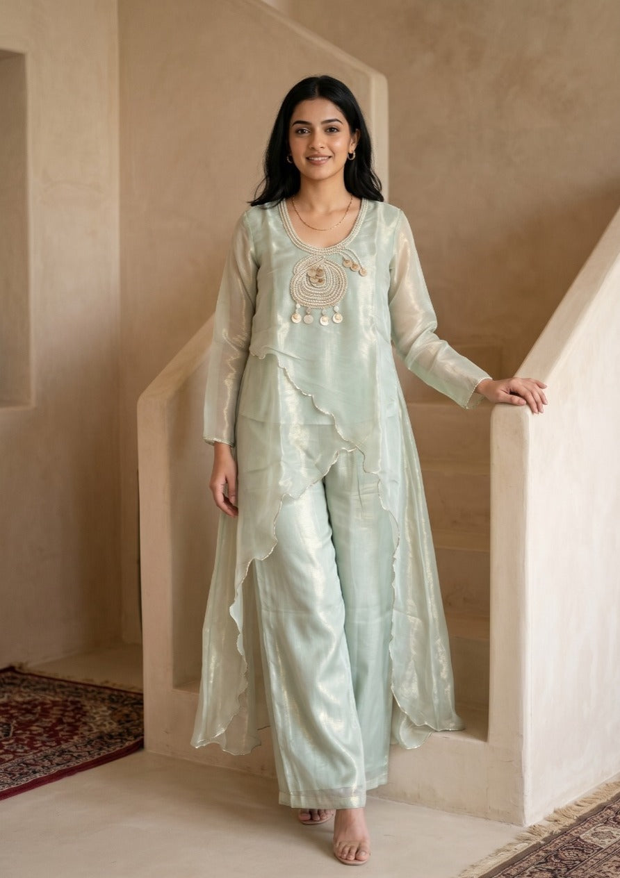 Woman wearing Mint Green Tissue Pearl Work Sharara Set | Kunvarani