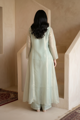 Woman wearing Mint Green Tissue Pearl Work Sharara Set | Kunvarani