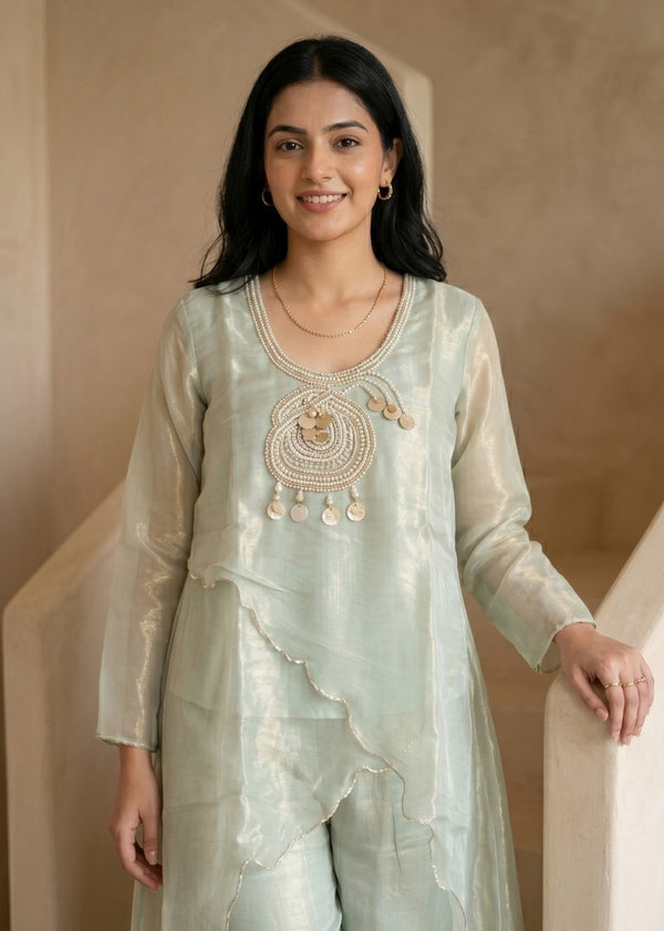 Woman wearing Mint Green Tissue Pearl Work Sharara Set | Kunvarani