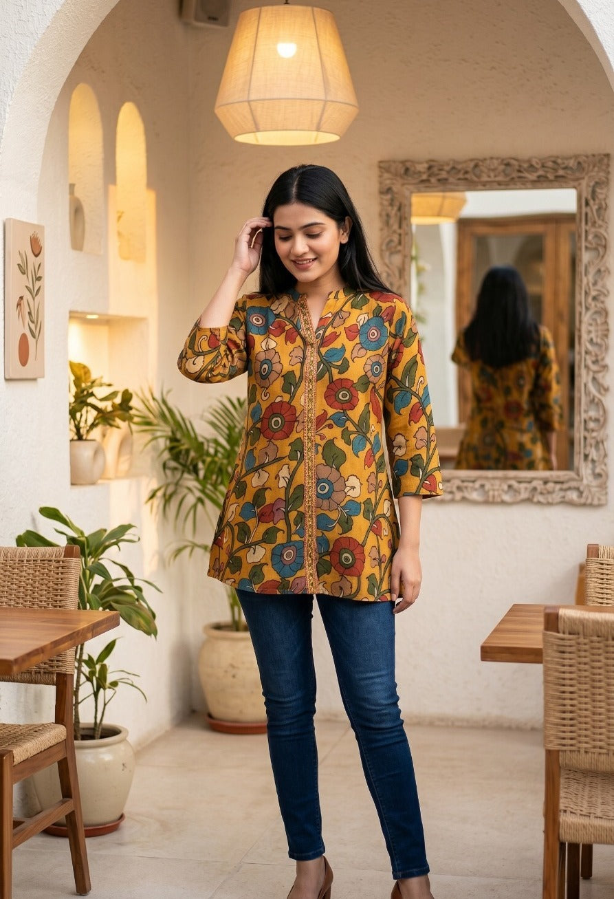Woman wearing Mustard Muslin Kalamkari Print Mandarin Collar Kurta | Kunvarani